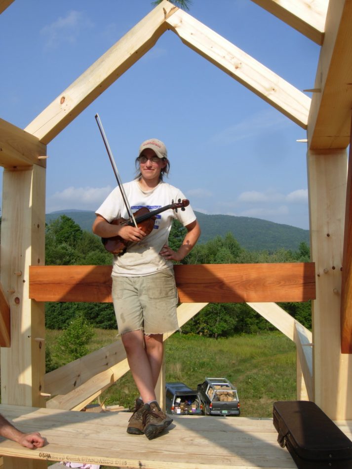 woman-timber-frame-carpenter-in pine-and-cherry-frame