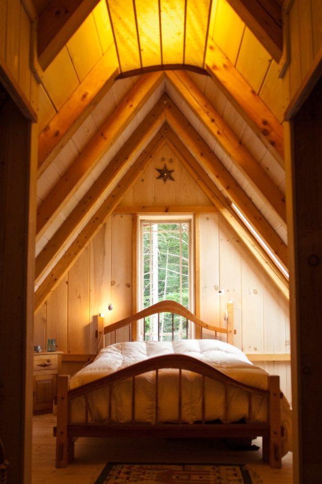 High Pitch Post and Beam Roof and Mortise and Tenon Bed in bedroom