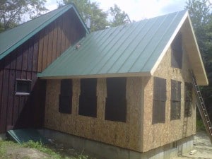 structural insulated panels enclose this timber frame addition