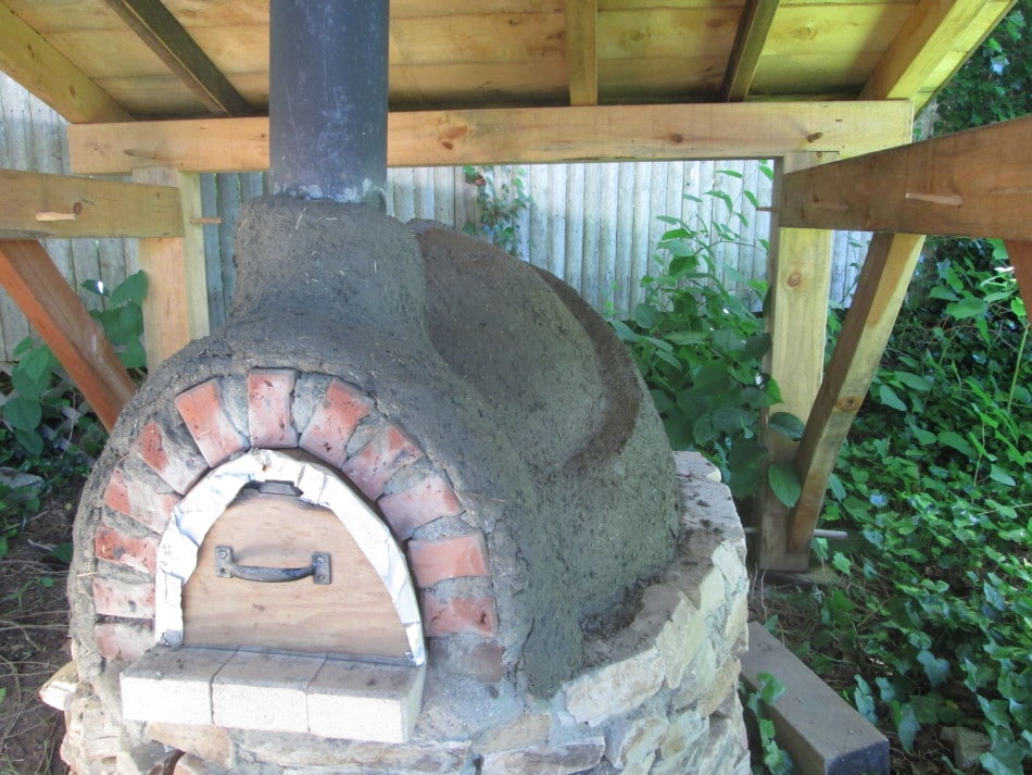 earth bake oven in Rhode Island with timber frame shelter