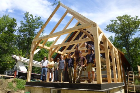A happy crew in the Berkshire sun on the job site of a timber frame addition