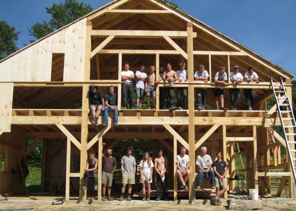 Compagnons du devoir from France help build the timber frame barn for a day