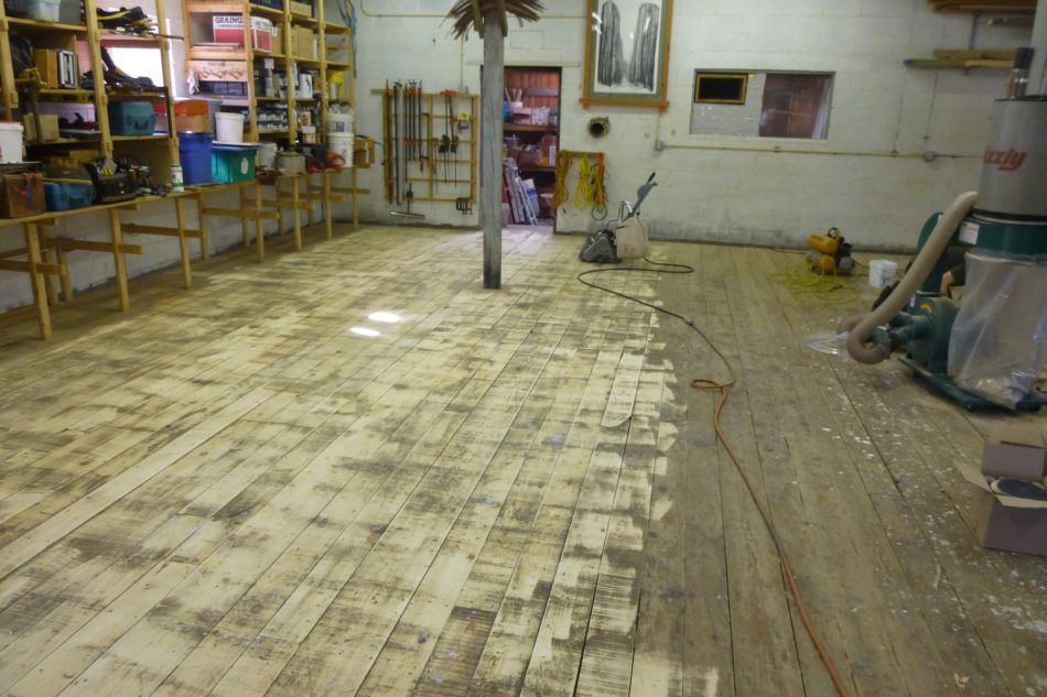 Shop Floor getting sanded for Plywood resurfacing