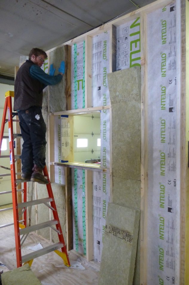 Rock Wool Insulation is installed in the stud bays of the interior framing layer. This layer is a service cavity for running wiring and plumbing; the air barrier is installed on the outside of the studs to minimize penetrations and therefore ensure a very well sealed wall assembly.