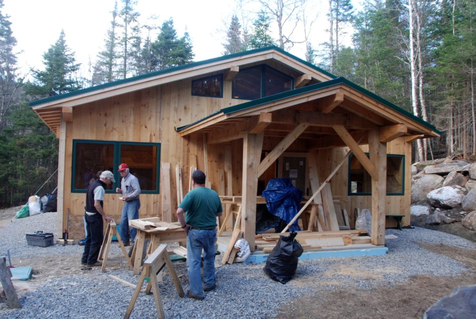 Front entrance of a timber frame bunkhouse in New Hampshire