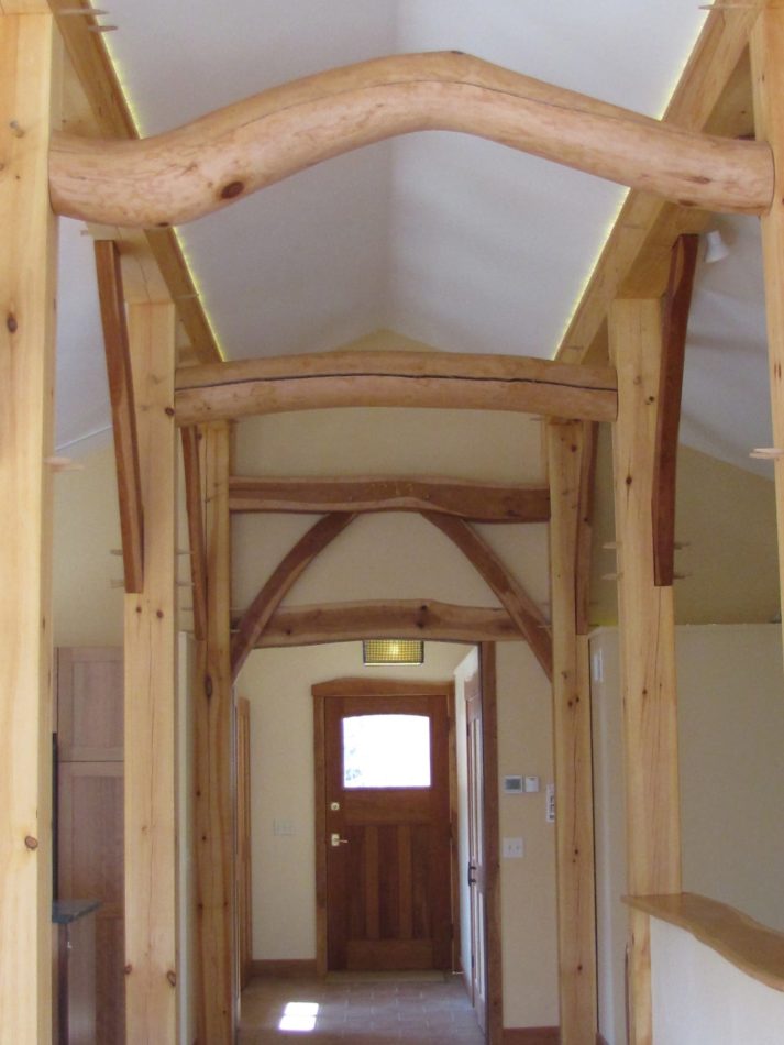 scribed timber frame corridor with arching beams