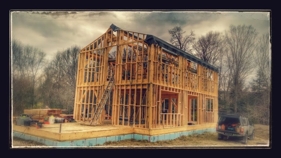 Hybrid timber frame and stick framed building