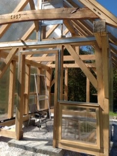 Finished Timberframe Greenhouse with glass panels