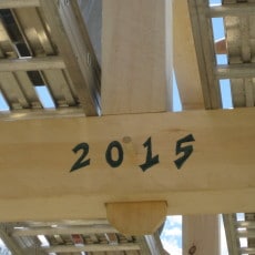 Year of the raising carved into a central tie beam.
