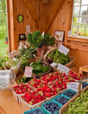 Fruits and veggies displayed at a Timber Framed farmstead
