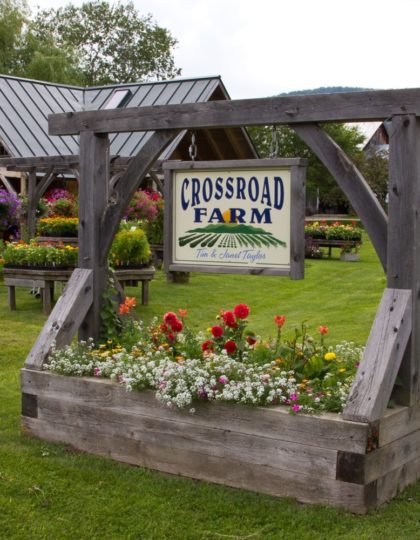 Crossroads Farmstead has a timber framed planter box sign