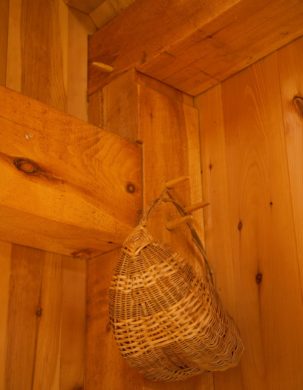 A beautiful basket hangs from the peg holding a mortise and tenon joint together