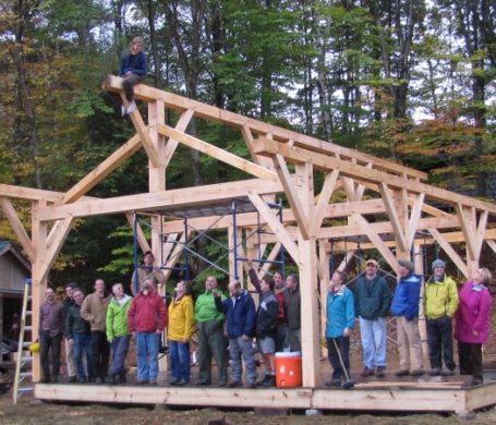 A timber frame barn raising, with the volunteer raising crew