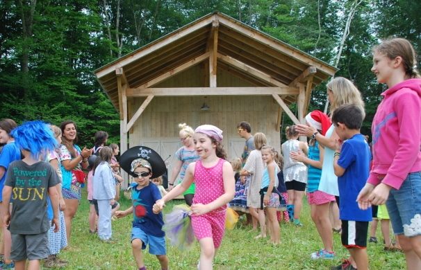 Children dance in front of the Arts and Crafts Barn in Vermont