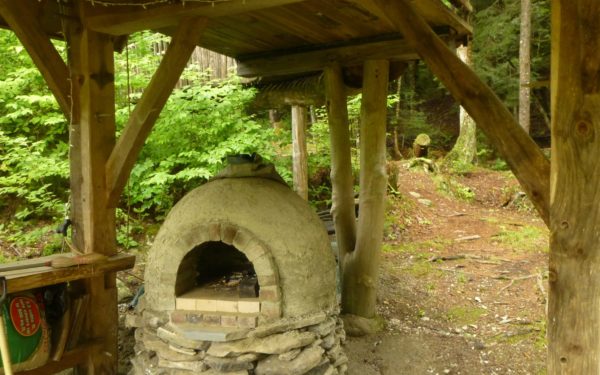 A round cob oven is ready for baking