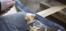 Drawknife shaves away ash curls while making a peg