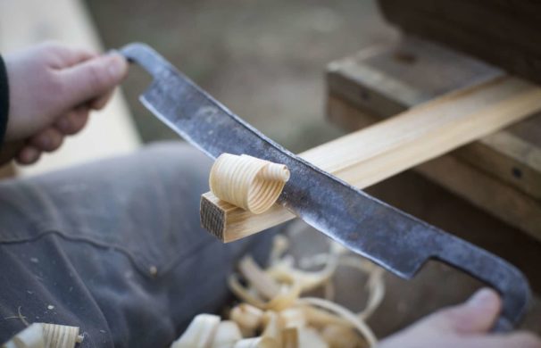 Drawknife shaves away ash curls while making a peg