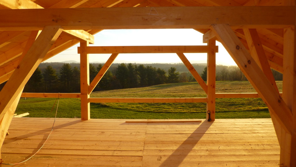 Post, beam and braces frame a beautiful view of a valley in Addison County