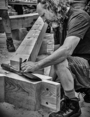 Skip Dewhirst, instructor, during a timber frame workshop in New Hampshire