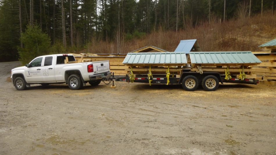 The TimberHomes truck is packed with two picnic shelters