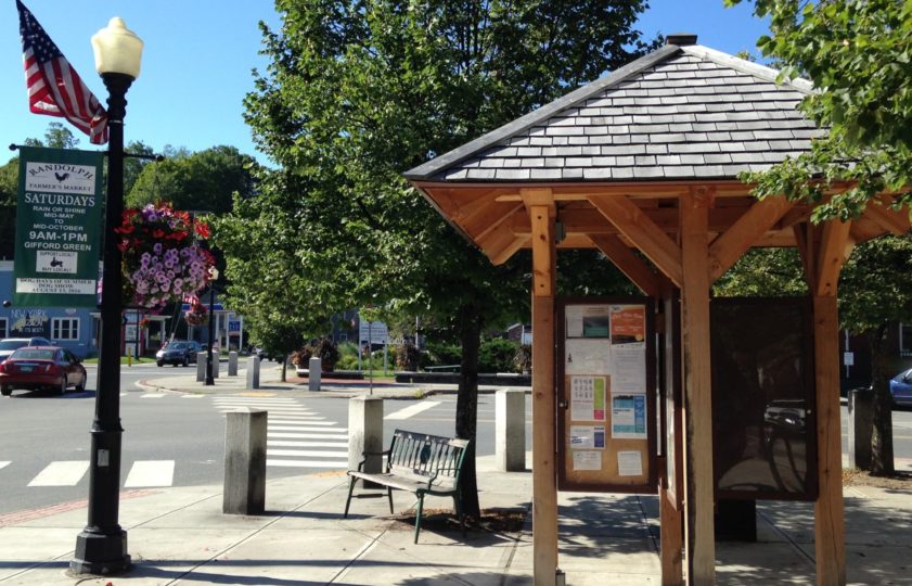 A post and beam kiosk in the center of Randolph VT provides passersby with information about the town