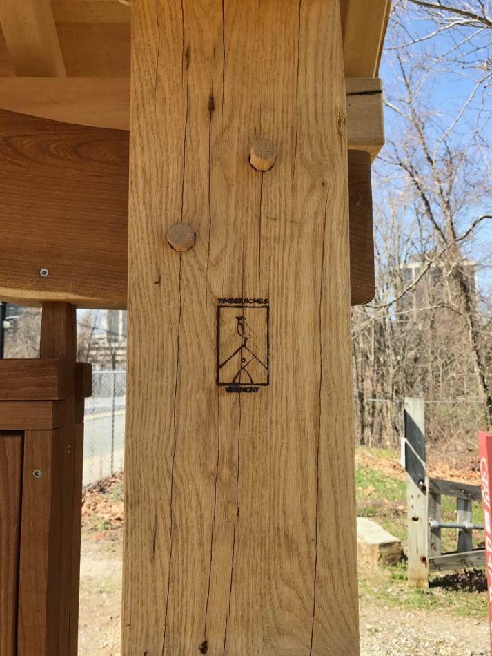 A brand burned into white oak for TimberHomes Vermont