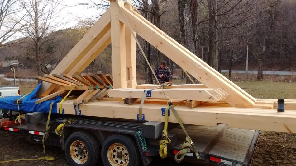 King Post trusses, sawhorses and curvy braces packed tight onto the TimberHomes trailer