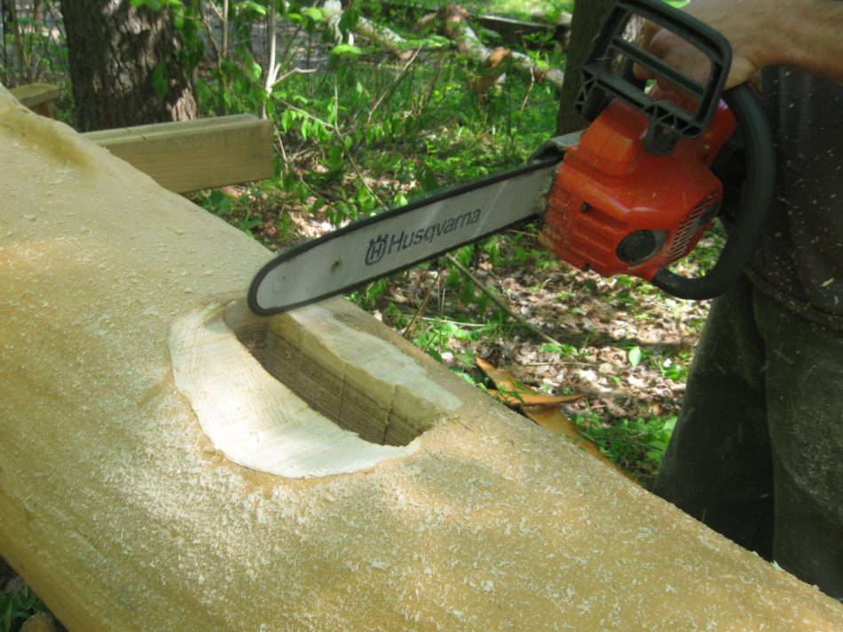 Using a chainsaw to rough out the housing for the Hubbard Park Clamshell Pavilion