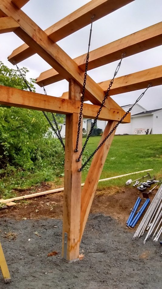 A post, outshot brace, tie beam and main rafter on a timber frame pavilion