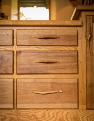 Cabinetry detail with organic form handles