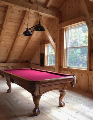 Pool table in a timber frame barn