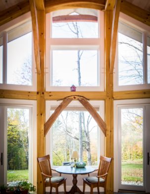 Secluded timber frame home full of windows and light.