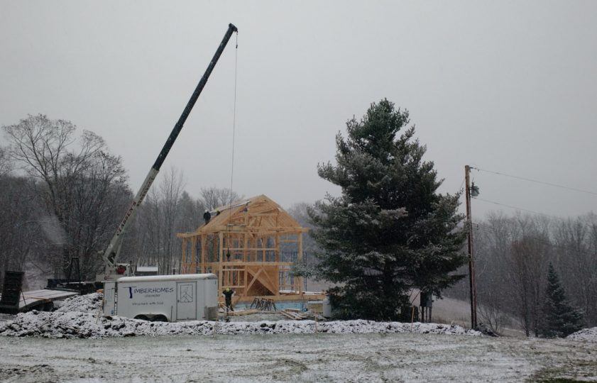 snowy raising day with a crane