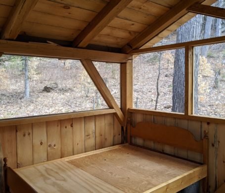 bed frame in timber frame summer bedroom