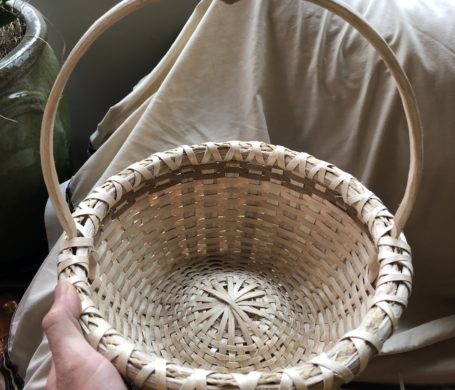 a cute, small, round gathering basket