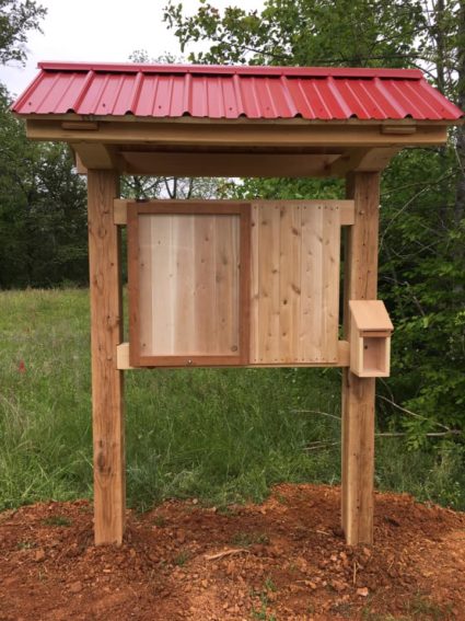 classic trailhead kiosk with red roof and brochure box