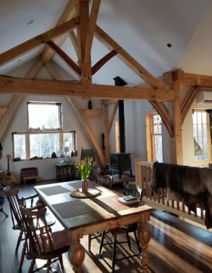 A beautiful timber frame home with curving beams.