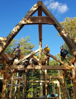 The construction crew on a timber frame raising site