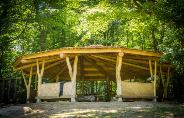 A reciprocating roof pavilion at a summer camp in Vermont, used as an outdoor classroom