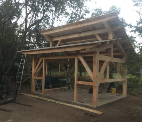 A timber frame cabin that's just been raised