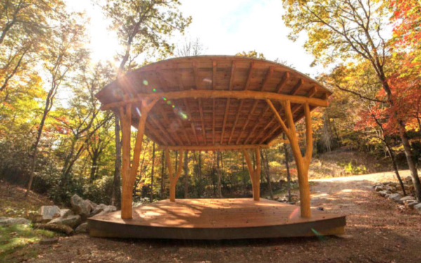 A timber framed pavilion in the woods