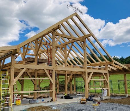 A horse barn in Lyme, NH just after the timber frame is raised.