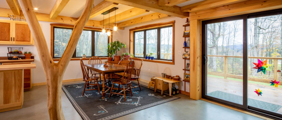 Interior photograph in a timber frame house of the dining room