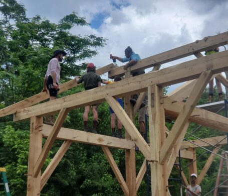 People work together to put the timbers into place