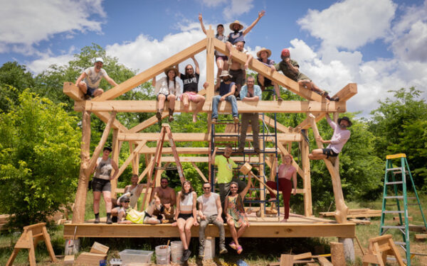 Workshop participants atop the hand cut poplar timber frame structure