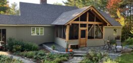 A new timber framed porch addition on a house in Norwich, VT