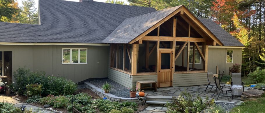 A new timber framed porch addition on a house in Norwich, VT