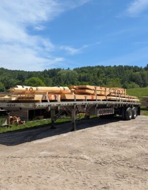 flatbed trailer loaded with timber frame