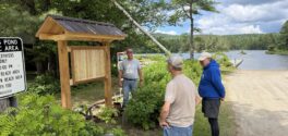 volunteers install a classic kiosk